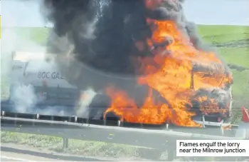  ??  ?? Flames engulf the lorry near the Milnrow junction