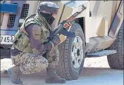  ?? ANI ?? A solider takes up position near a mosque where militants took refuge during the gunfight in Pulwama on Thursday.