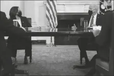  ?? PHOTO BY EVAN VUCCI/ASSOCIATED PRESS ?? PRESIDENT JOE BIDEN SPEAKS WITH Vice President Kamala Harris about the southern border during a meeting in the White House in Washington on Wednesday.