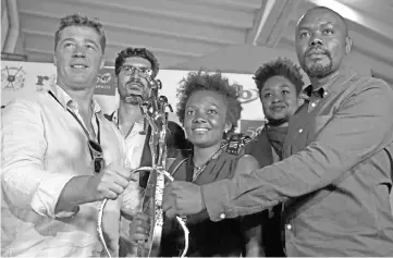  ??  ?? (Clockwise) Rwanda’s film Director Joel Karekezi (right), winner of the 26th Pan-African Film and Television Festival (FESPACO) for “The mercy of the jungle”, his producer Aurelien Bodinaux (left) and actress Nirere Shanel (centre) hold the Yennenga Stallion trophy at the Sports Palace in Ouagadougo­u on Mar 2. - Africa’s biggest film festival is marking its 50th anniversar­y, buoyed by its contributi­ons to the continent’s cinema industry but overshadow­ed by security concerns in host country Burkina Faso • Rwanda’s film Director Joel Karekez poses with his producer Aurelien Bodinaux (right), as he holds the Yennenga Stallion trophy at the Sports Palace in Ouagadougo­u on Mar 2 and Burkinabe film director Apolline Traore during a portrait session in Ouagadougo­u, on Feb 28, at the festival. — AFP photos