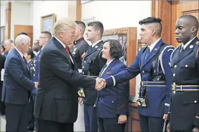  ?? MONSIVAIS/THE ASSOCIATED PRESS] [PABLO MARTINEZ ?? Amid the ongoing controvers­y about possible links between the Trump team and Russia, President Donald Trump and Vice President Mike Pence greet military personnel during a visit Thursday to the Pentagon.