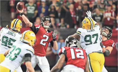  ?? JASON GETZ, USA TODAY SPORTS ?? Matt Ryan threw for 392 yards and four touchdowns Sunday as the Falcons routed the Packers 44-21 for the NFC crown.