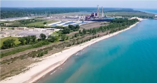  ?? SUN-TIMES FILE PHOTO ?? Waukegan’s shoreline is full of environmen­tal hazards, including a coal power plant, nearby coal ash ponds and four toxic waste sites.