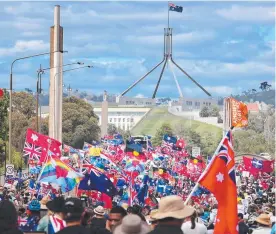  ?? ?? This massive crowd marching on Parliament House in 2022 could not gain access or have their voices heard inside the corridors of power as they lacked the orange lanyards. Picture: Gary Ramage