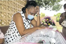  ??  ?? Patsy Mccubbin Montaquemo­urns the loss of her daughter at a thanksgivi­ng service held at the Mountian view New Testament Church of God on Tuesday.
