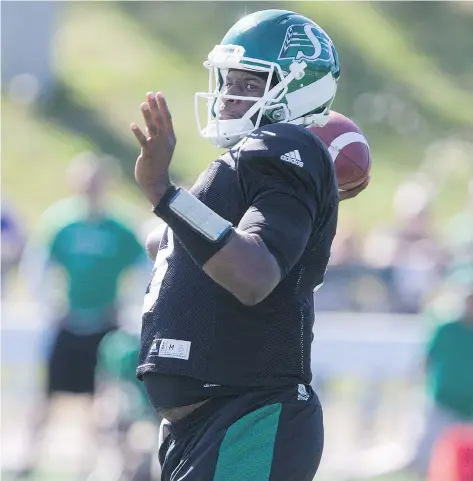  ?? KAYLE NEIS ?? Former NFLer Vince Young, one of five quarterbac­ks on the Roughrider­s training camp roster, gets set to pass during a mock game at Saskatoon Minor Football Field on Saturday.