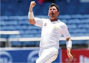  ?? AFP PIC ?? Pakistan’s Yasir Shah celebrates after taking a wicket against the West Indies on Wednesday.