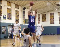  ??  ?? Braeden Southam (23) of Durham puts up a jumper in the lane over Hamilton’s Mario Valazquez (14) with Manny Rios (2) and Jared Strong (5) of the Braves trailing Friday night at Hamilton High.