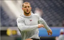  ?? Jae C. Hong / Associated Press ?? Defensive end Nick Bosa had a would-be sack of quarterbac­k Jimmy Garoppolo in his first practice snap Wednesday.