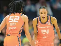  ?? ABBIE PARR/AP ?? Sun forward Dewanna Bonner, right, celebrates toward guard Tyasha Harris after Harris made a three-point basket during the second half of Game 3 of a WNBA first-round playoff series against the Lynx on Sept. 20 in Minneapoli­s.