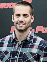  ?? ANDREW MEDICHINI/AP ?? Paul Walker promotes “Fast Five” in Rome in 2011. He died in 2013; his brothers are open to playing his role.