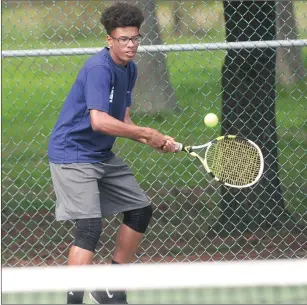  ?? File photo by Ernest A. Brown ?? Pawtucket co-op No. 4 singles player Orlando Correia defeated Woonsocket’s Horia Padurean, 6-2, 6-2, to help the Tigers defeat the Villa Novans, 5-2, Wednesday at Slater Park.