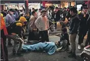  ?? Anthony Wallace AFP/Getty Images ?? A VICTIM lies on a Seoul street after the deadly crush. Dozens of people suffered cardiac arrest.