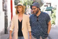  ?? Hector Alvarez / Lionsgate ?? Charlize Theron plays a polished presidenti­al candidate and Seth Rogen her bedraggled speechwrit­er in “Long Shot.”