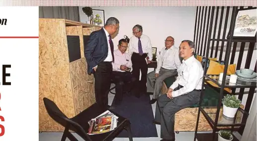  ?? PIC BY MAHZIR MAT ISA ?? Mayor Datuk Nor Hisham Ahmad Dahlan (second from right) and his officers checking out a City Hall micro-housing unit in Jalan Tuanku Abdul Rahman, Kuala Lumpur, yesterday.