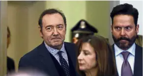  ?? — AP ?? Courtroom drama: Spacey (left) entering the courtroom with his attorneys Juliane Balliro and Jackson (right) for arraignmen­t.