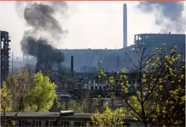  ?? ?? Smoke rises from the Metallurgi­cal Combine Azovstal in Mariupol