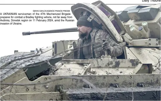  ?? GENYA SAVILOV/AGENCE FRANCE-PRESSE ?? A UKRAINIAN serviceman of the 47th Mechanized Brigade prepares for combat a Bradley fighting vehicle, not far away from Avdiivka, Donetsk region on 11 February 2024, amid the Russian invasion of Ukraine.