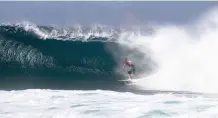  ?? | WSL Keoki ?? SEBASTIAN Zietz pulls into a tube at the Volcom Pipe Pro held at Pipeline recently.