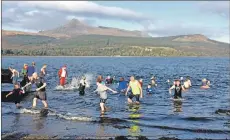  ?? 01_B02dook07 ?? Making a splash: dookers enter the water while others make a hasty exit.