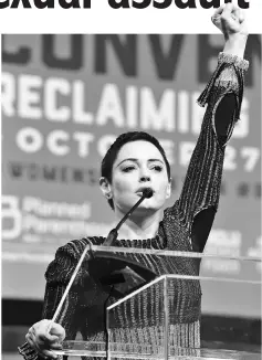  ??  ?? McGowan speaks on stage at The Women’s Convention at Cobo Centre on Friday in Detroit, Michigan. (Below) McGowan addresses the audience during a panel discussion on ‘Survivors of Sexual Assault in the Age of Betsy Devos’ during the convention. — AFP/...