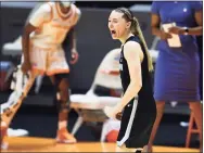  ?? Saul Young / Associated Press ?? UConn’s Paige Bueckers yells out in celebratio­n after hitting a 3-pointer against Tennessee in the final moments of the Huskies’ 67-61 victory Thursday night in Knoxville, Tenn.