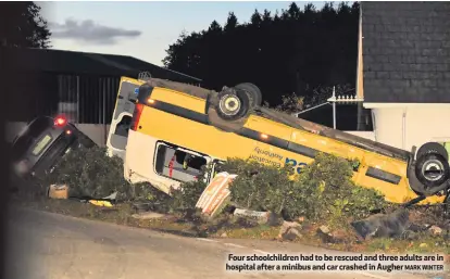  ?? MARK WINTER ?? Four schoolchil­dren had to be rescued and three adults are in hospital after a minibus and car crashed in Augher