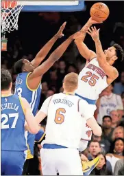  ?? Kathy Willens / The Associated Press ?? New York guard Derrick Rose (25) shoots as Golden State forward Draymond Green (23) defends with Warriors Zaza Pachulia (27) and Knicks forward Kristaps Porzingis (6) watching Sunday at Madison Square Garden in New York.