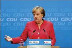  ??  ?? German Chancellor Angela Merkel attends a news conference after a leaders meetings of her Christian Democratic Union party at the party’s headquarte­rs in Berlin on Monday. AP PHOTO/MARKUS SCHREIBER