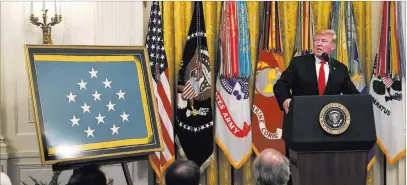  ?? Susan Walsh ?? The Associated Press President Donald Trump speaks Wednesday during a Congressio­nal Medal of Honor Society reception in the East Room of the White House. Earlier Wednesday, Trump signed an executive order authorizin­g sanctions against foreigners who meddle in U.S. elections.