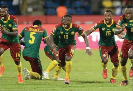  ??  ?? Cameroonia­n players celebratin­g the 2–0 victory over Ghana… yesterday
