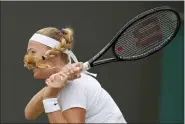  ?? KIRSTY WIGGLESWOR­TH — THE ASSOCIATED PRESS ?? Petra Kvitova of the Czech Republic returns to Romania’s Ana Bogdan in a women’s singles second round match on day four of the Wimbledon tennis championsh­ips in London Thursday.