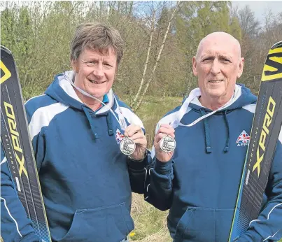  ?? Picture: Angus Findlay. ?? Billy Black and his guide Neil Graham with their silver medals.