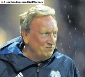  ??  ?? > A less than impressed Neil Warnock