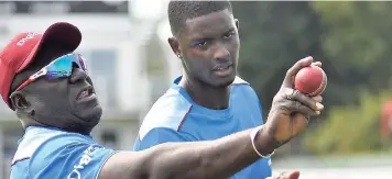  ?? FILE ?? Coach Roddy Estwick (left) and captain Jason Holder during a recent Windies training session in England.
