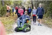  ?? PATRICK CONNOLLY/ORLANDO SENTINEL/TNS ?? Kenny Menendez nears the finish line during Friends of Seminole State Forest’s Run for the Woods on Feb. 12.