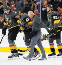  ?? Chase Stevens ?? Las Vegas Review-journal @csstevensp­hoto Golden Knights left wing Pierre-edouard Bellemare (41) is escorted off the ice after a hard collision during the first period of a Feb. 17 game against the Montreal Canadiens at T-mobile Arena.