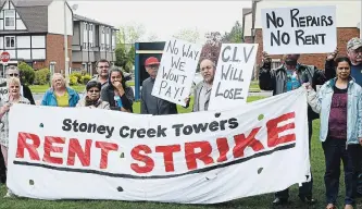  ?? JOHN RENNISON THE HAMILTON SPECTATOR ?? Tenants on a rent strike in front of Stoney Creek Towers at 40 Grandville Ave., in east Hamilton. Based on 2016 census data, ACTO found 45.4 per cent of renter households in Hamilton pay unaffordab­le rates.