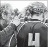  ?? SUBMITTED ?? Raymond Moore, left, counsells a player on the sideline of a rugby pitch. Moore is going into the P.E.I. Rugby Union Hall of Fame for his work as an organizer, coach and administra­tor.