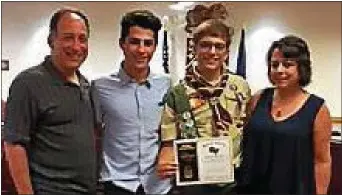  ?? SUSAN L. SERBIN — DIGITAL FIRST MEDIA ?? Garnet Valley student and new Eagle Scout Ben Slomowitz, left, flanked by parents Scott and Cyndy. his twin brother Joe to his