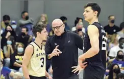  ?? John Fajardo LBSU Athletics ?? LONG BEACH STATE coach Alan Knipe, center, is one reason why the men’s volleyball team is eyeing a third NCAA championsh­ip in five years.