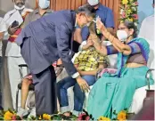  ?? — C. NARAYANA RAO ?? Chief Justice of India N.V. Ramana takes the blessings of Nagendramm­a, wife of Lavu Venkateswa­rlu and mother of Justice L. Nageswara Rao, during an endowment lecture in Vijayawada on Sunday.