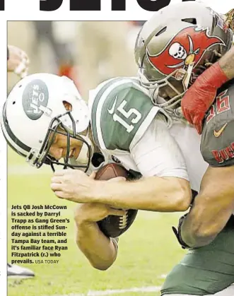  ?? USA TODAY ?? Jets QB Josh McCown is sacked by Darryl Trapp as Gang Green’s offense is stifled Sunday against a terrible Tampa Bay team, and it’s familiar face Ryan Fitzpatric­k (r.) who prevails.