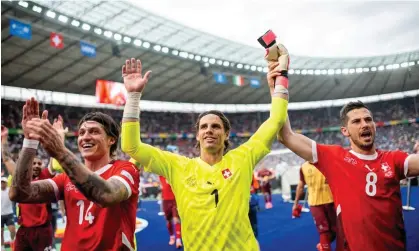  ?? Mateusz Słodkowski/Getty Images ?? From left to right: Steven Zuber, Yann Sommer and Remo Freuler celebrate after knocking out the defending champions Italy. Photograph: