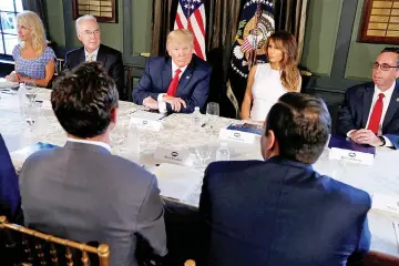  ??  ?? Trump (centre) with Melania Trump (right) meets with Secretary of Health and Human Services (HHS) Tom Price (left) to discuss opioid addiction during a briefing at Trump’s golf estate in Bedminster, New Jersey, US. — Reuters photo