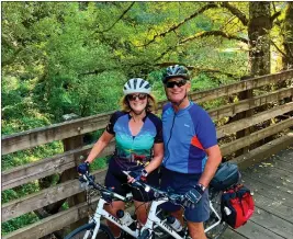  ?? COURTESY OF THE LARSON FAMILY ?? Sue and Ted Larson's latest biking adventure has taken them across five states and more than 500miles, including this stretch on the Banks-Vernonia State Trail near Portland, Oregon.