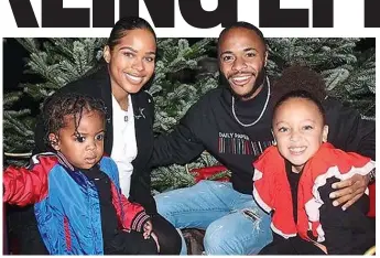  ??  ?? Happy families: Sterling in a Christmas image he posted on Instagram