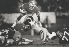  ?? Frederic Larson / The Chronicle 1986 ?? 49ers running back Roger Craig, shown in a 1986 game against the Los Angeles Rams, had 8,189 yards rushing and 4,911 yards receiving in his career.