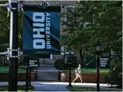  ?? BROOKE LAVALLEY / COLUMBUS DISPATCH ?? Students walk on College Green at the Ohio University campus. The United Academics of Ohio University submitted more than 550 signed cards to the State Employee Relations Board in Columbus on Friday to file for a union election.