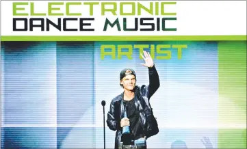  ??  ?? Avicii accepts the favourite electronic dance music artiste award at the 41st American Music Awards in Los Angeles, California on Nov 24, 2013. — Reuters file photo